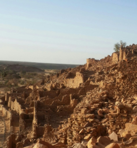 Ancient architecture of Ouadane, a UNESCO World Heritage Site in Mauritania, showcasing historical buildings and desert landscapes.