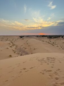 Vast sand dunes near Chinguetti, Mauritania, with golden sands stretching into the horizon. A highlight of Adrar Desert Adventure Tours