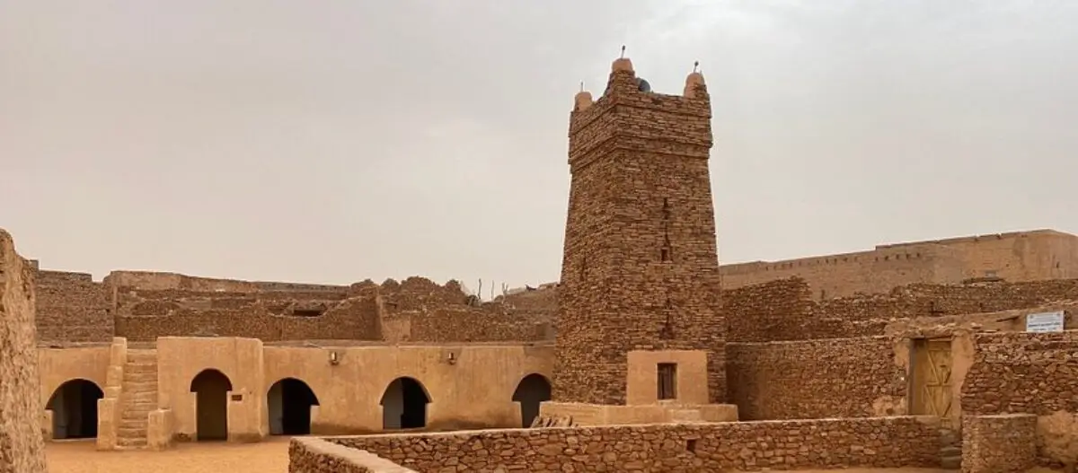 Adrar Expedition:Mauritanian ToursThe Chinguetti Old Mosque, a key highlight of the Chinguetti tour, showcases ancient architecture with its square minaret. It reflects the city's historical and spiritual significance, making it a must-see on your visit.