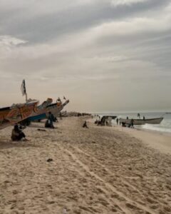 Nouakchott’s coastline with bustling markets, fishing boats, and cultural landmarks.